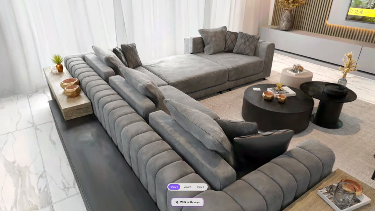 The lounge: a velvet L-shaped sofa, round coffee tables and a marble floor